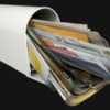photo of a mail box with junk mail overflowing