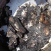 A stainless steel pot with burned food.