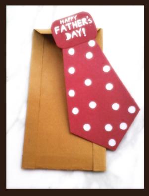 Father's Day red polka dotted tie card with brown envelope.