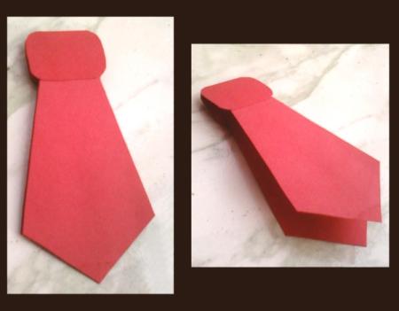 Father's Day red tie paper cutout. 