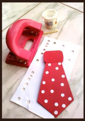 Hole punch, glue and tie with polka dots