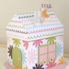 A paper maché house with roof.