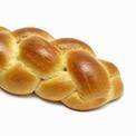 A braided loaf of buttermilk challah bread.