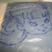 Tracing a pattern using recycled liners from cereal boxes.