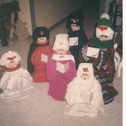 group of six completed carolers, four adults and two children