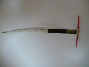 rolling magazine strip around a toothpick