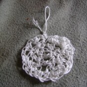 White crocheted pot scrubber