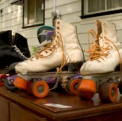 two pair of roller skates on table