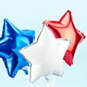 Photo of three star shaped mylar balloons.