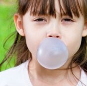 picture of a girl blowing a bubble