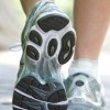 A picture of the feet of a woman in running shoes.