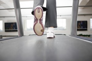 Woman's Feet Running on Treadmill