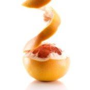 A grapefruit being peeled.