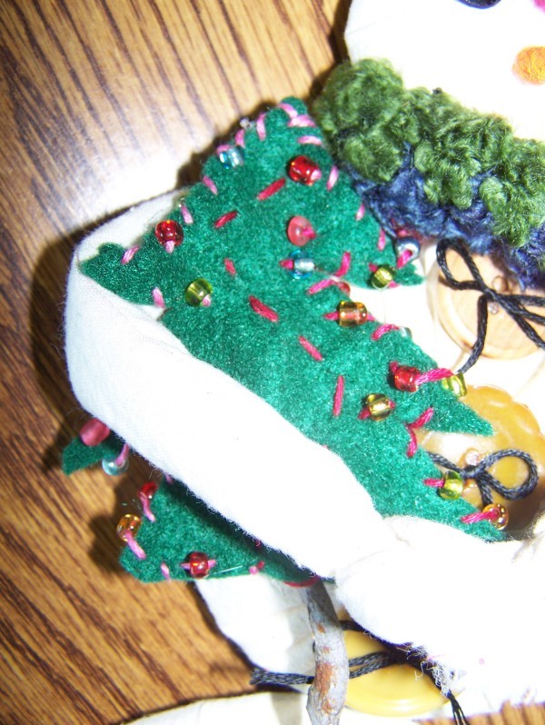 Closeup detail of a Snowman Plant Stake 