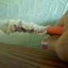 Pullilng fabrid through tube with needle nose pliers