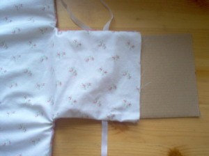Cardboard being put into fabric sleave