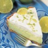 Slice of Key Lime Pie on Blue Plate with Fork