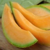 Cantaloupe slices on a table.