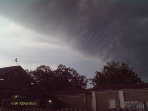 Storm Clouds Moving In Over Brick Building