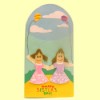 Finished sister card, two popsicle stick girls on a blue background with clouds
