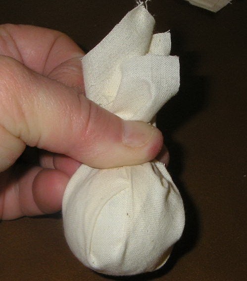 Styrofoam ball in a square of fabric