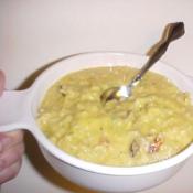 Soup bowl with Broccoli Cheese Noodles and a spoon