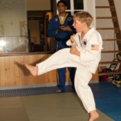 Boy in white uniform doing karate move