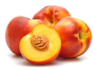 Cut and uncut ripe nectarines.