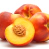 Cut and uncut ripe nectarines.