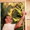 Carpenter Building a Shed