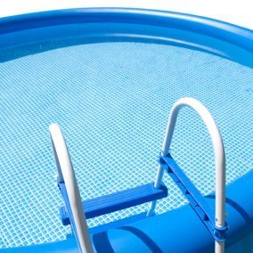 A blue above ground swimming pool.