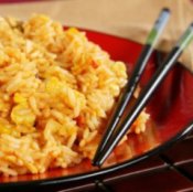 Plate of fried rice with chopsticks.