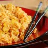 Plate of fried rice with chopsticks.