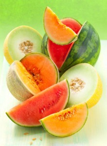 Several different types of cut melons.