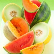 Several different types of cut melons.