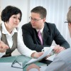 Woman Speaking with Her husband and Divorce Lawyer