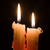 Two Lit Candles in the Dark