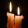 Two Lit Candles in the Dark
