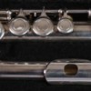 A flute in sections stored in a case.