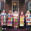Five women holding finished Mason jar quilts.