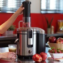 Woman juicing fruits
