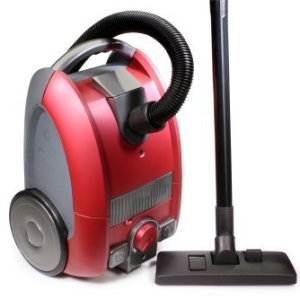 Red canister vacuum on white background.