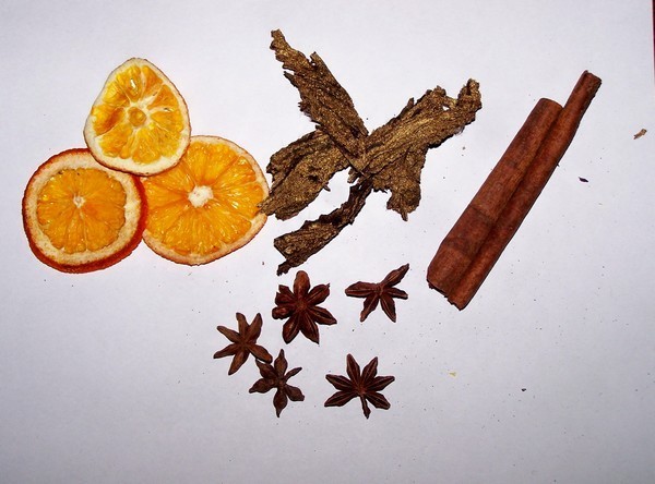 Dried oranges, cinnamon sticks, star anise, dried cinnamon flowers
