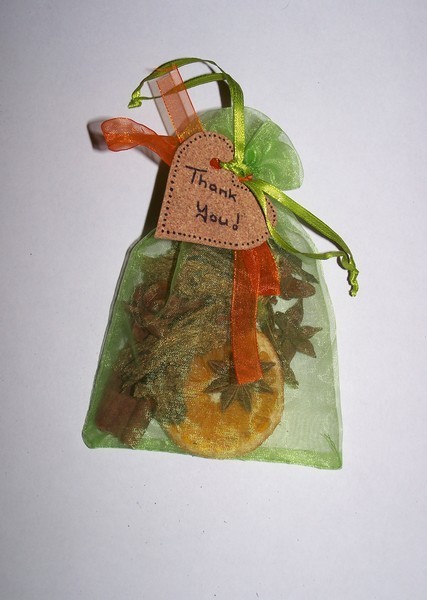 potpourri bag with orange ribbon attached
