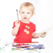 Little girl painting.