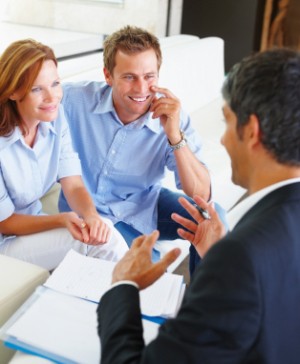 Selecting a Broker or Financial Planner, Happy Couple Talking With Financial Consultant