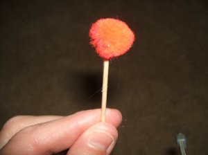 Red Pompom on end of toothpick