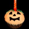 Cupcake decorated as a jack-o-lantern.