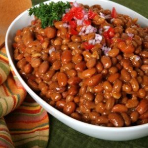 Baked beans in a white bowl.