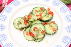 A plate of cucumber salad, ready to be eaten.